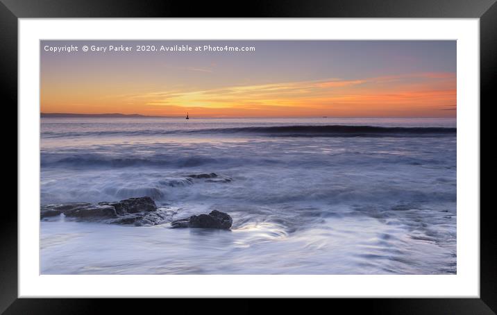 Waves rolling over rocks on the shoreline Framed Mounted Print by Gary Parker