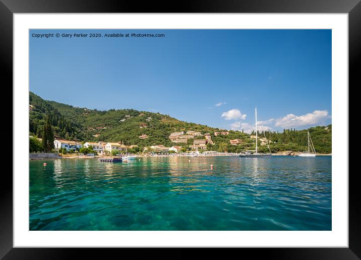 The clear waters of Kalami Bay, in Corfu, Greece, on a bright summers day	 Framed Mounted Print by Gary Parker