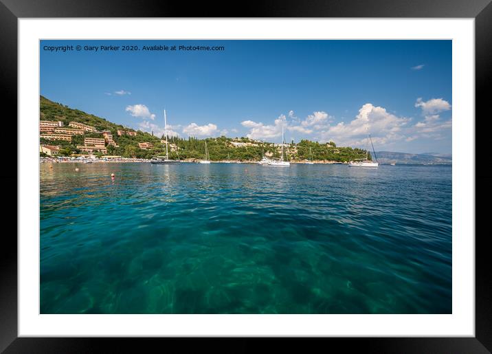 The clear waters of Kalami Bay, in Corfu, Greece, on a bright summers day	 Framed Mounted Print by Gary Parker