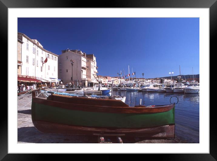 Green boat under dramatic sunny noon in St. Tropez Framed Mounted Print by Alfredo Bustos