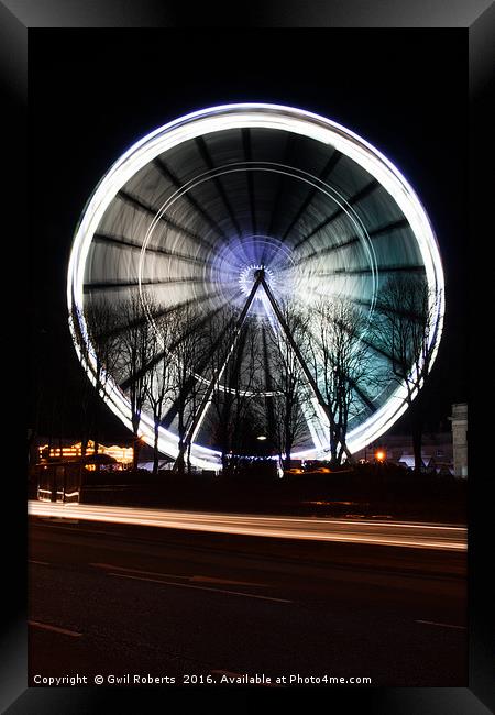 Ferris wheel in motion Framed Print by Gwil Roberts