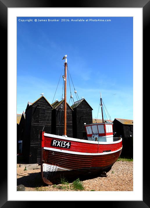 Fishing boat and historic net shops Hastings Framed Mounted Print by James Brunker