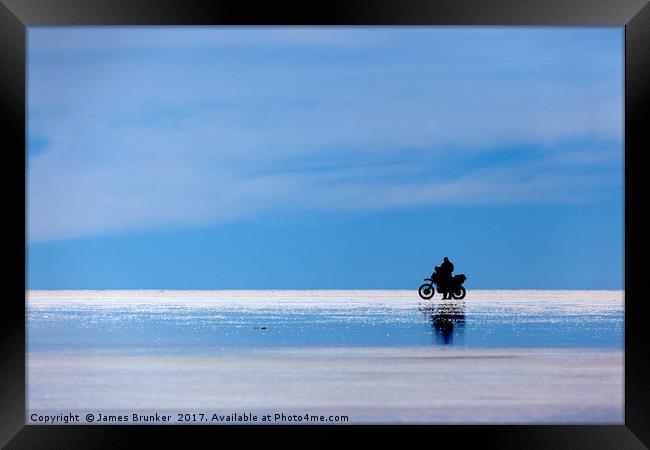 Motorbike Trip Across the Salar de Uyuni Bolivia Framed Print by James Brunker