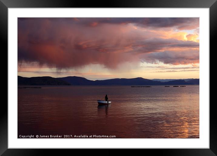 Stormy Sunset and Fisherman on Lake Titicaca Framed Mounted Print by James Brunker
