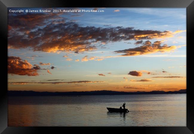 Fishing on Lake Titicaca Under a Fiery Sunset Framed Print by James Brunker