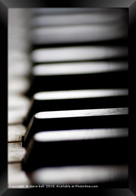 Old piano keys close up Framed Print by steve ball