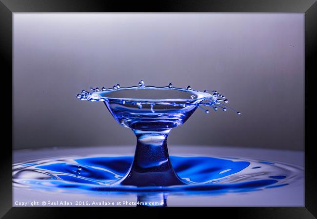 Blue bowl shaped water drop collision Framed Print by Paul Allen