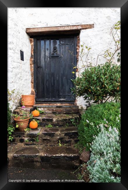 Old cottage door with pumpkins outside, Minehead, Somerset, UK Framed Print by Joy Walker