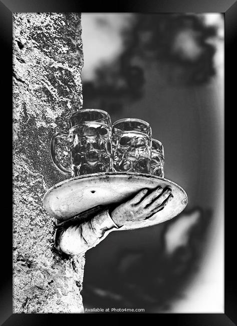 A model of a disconnected hand and beer glasses balanced on a tray Framed Print by Joy Walker