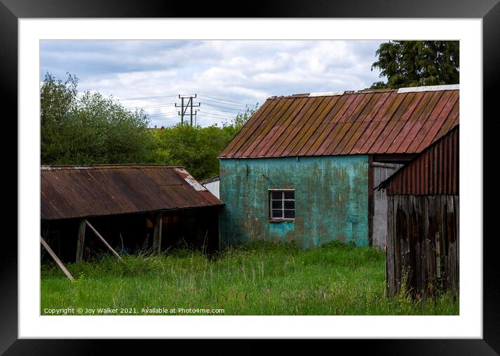 A window in an old barn which is abandoned and falling down Framed Mounted Print by Joy Walker