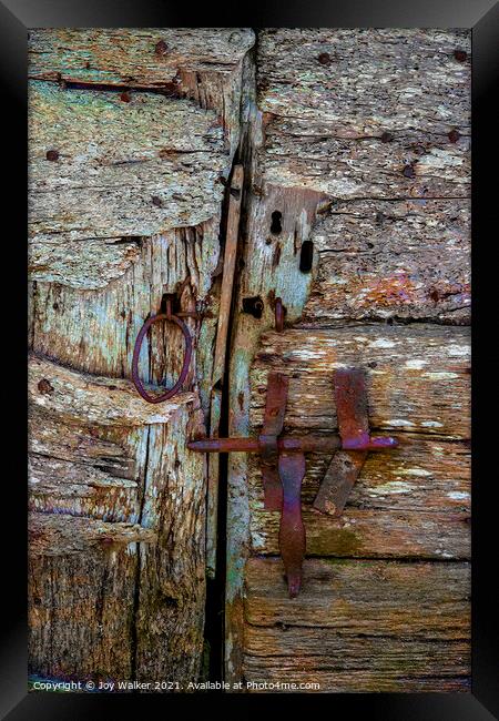 Detail of an old barn door showing the bolt and handle in a closed position Framed Print by Joy Walker