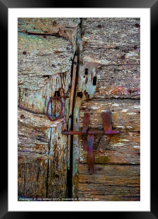 Detail of an old barn door showing the bolt and handle in a closed position Framed Mounted Print by Joy Walker