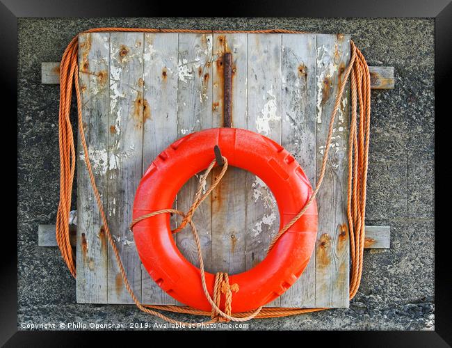life buoy on a weathered wooden board with faded o Framed Print by Philip Openshaw