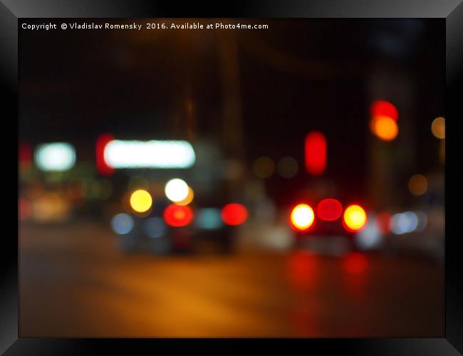 Defocused red and yellow lights on the night the t Framed Print by Vladislav Romensky