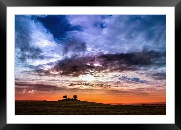 Colourful cloudy sky sunset behind a small hill Framed Mounted Print by André Jorge