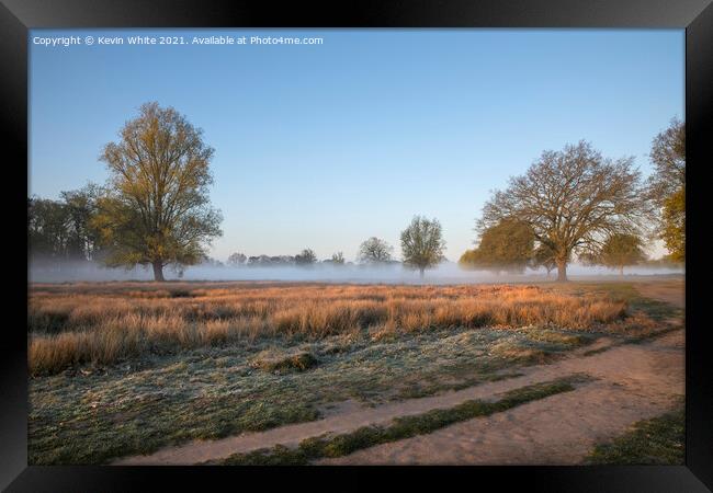 Sun breaking through Framed Print by Kevin White