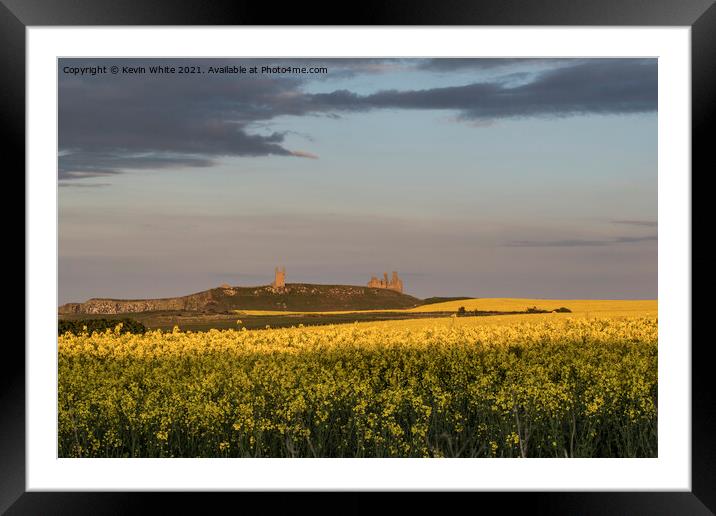 Dunstanburgh Castle just before sunset Framed Mounted Print by Kevin White