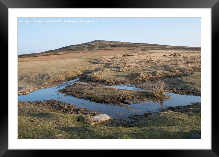 Reflections of a clear sky in a puddle Framed Mounted Print by Kevin White