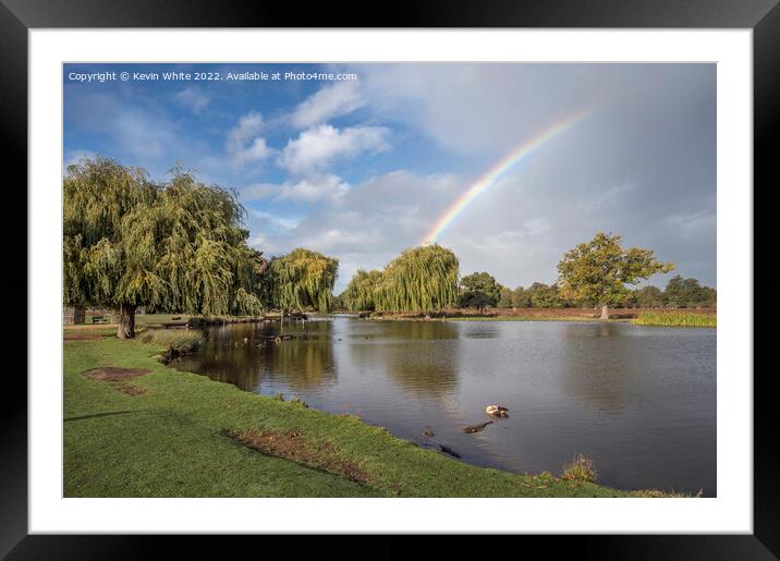 Rainbow over ponds Framed Mounted Print by Kevin White