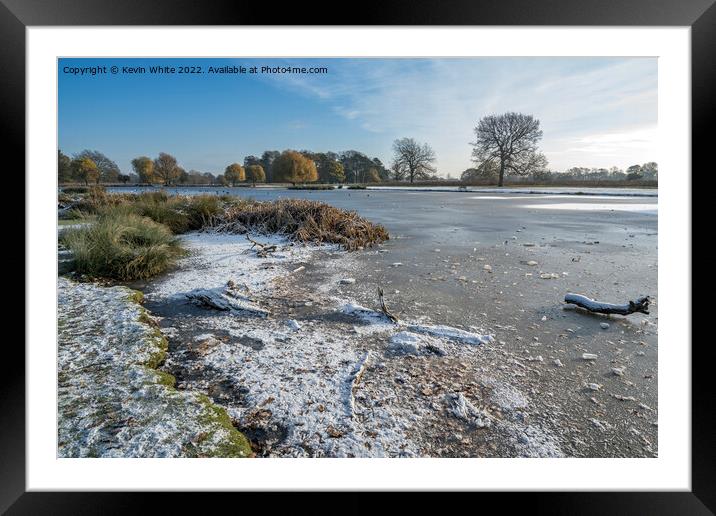 Icy lake  with a sprinkle of snow Framed Mounted Print by Kevin White