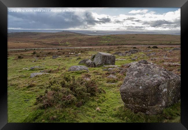 Rugged desolate Dartmoor with single road in background Framed Print by Kevin White