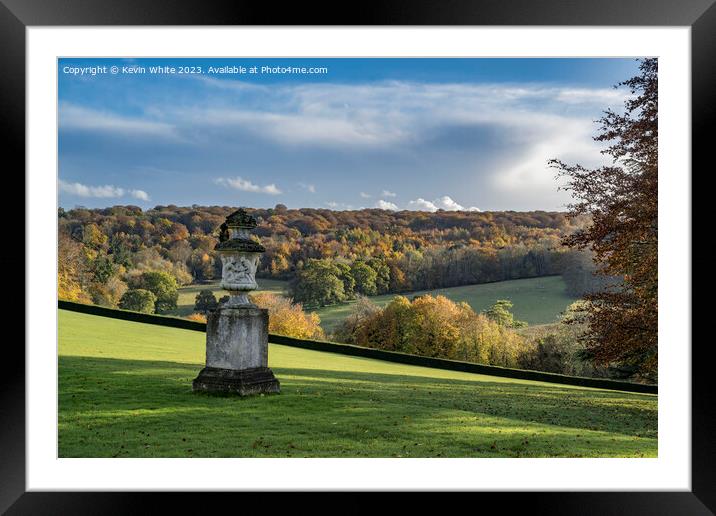 Sunlight on the autumn colours  breaking through the clouds Framed Mounted Print by Kevin White