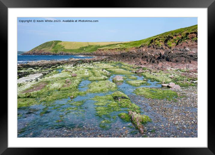 Mossy rocks on edge of Manorbier beach Pembrokeshire Framed Mounted Print by Kevin White