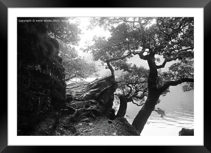 Overgrown path by lake Framed Mounted Print by Kevin White