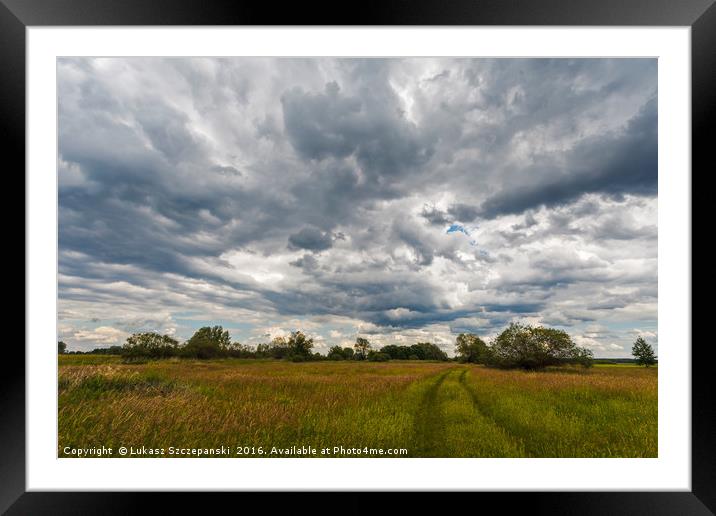 Stormy clouds over meadow Framed Mounted Print by Łukasz Szczepański