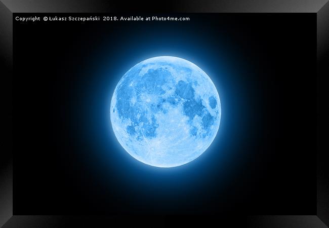 Blue super moon glowing with blue halo isolated on Framed Print by Łukasz Szczepański