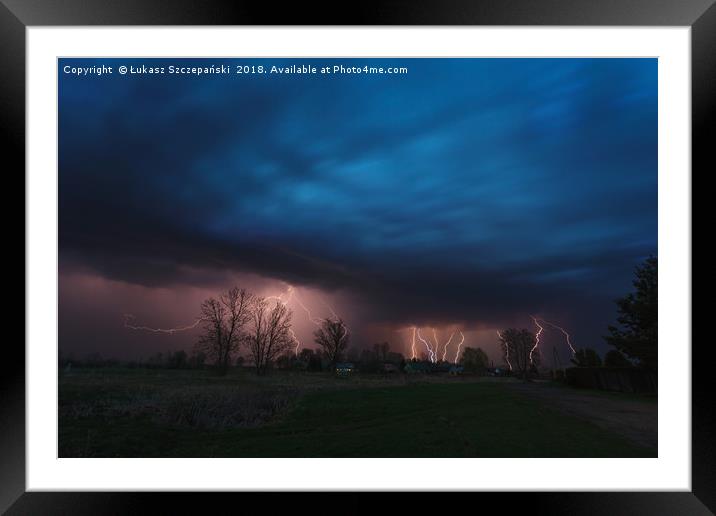 Multiple lightning strikes under dramatic sky Framed Mounted Print by Łukasz Szczepański