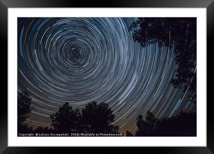 Starry night sky, startrails between trees landsca Framed Mounted Print by Łukasz Szczepański
