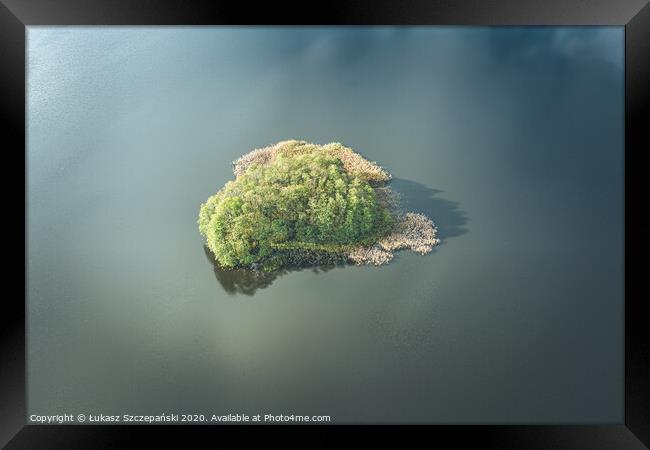 Aerial view of small island on the lake and clouds Framed Print by Łukasz Szczepański