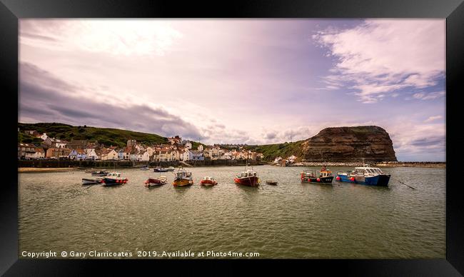 Protecting Staithes Framed Print by Gary Clarricoates