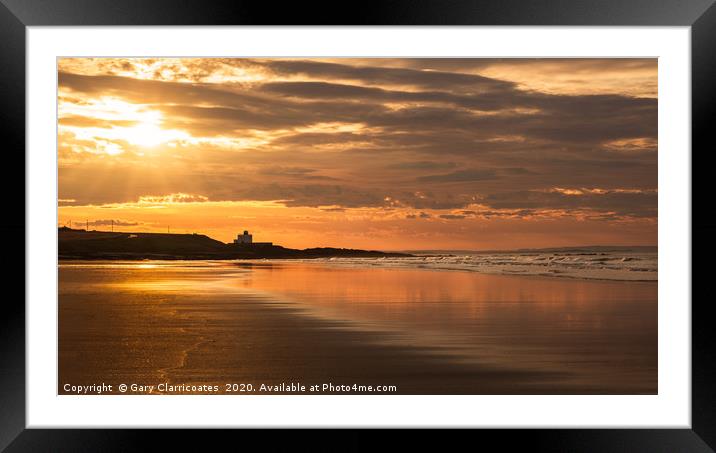 Bamburgh Lighthouse at Sunset Framed Mounted Print by Gary Clarricoates