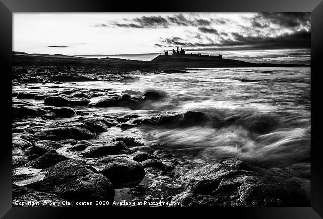 Mood at Dunstanburgh Framed Print by Gary Clarricoates