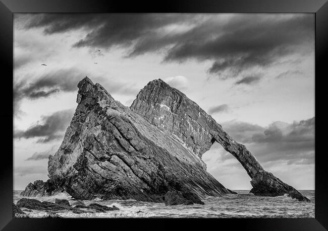Bowfiddle Rock in Scotland Framed Print by Brian Sandison