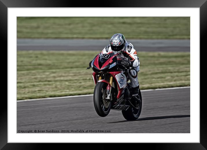 Popping a Wheelie Framed Mounted Print by Brian Sandison