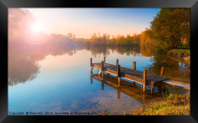 Single jetty on a calm lake Framed Print by Alan Hill