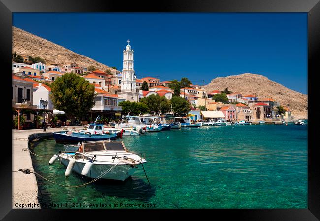 Multi-coloured buildings of Halki Island Framed Print by Alan Hill