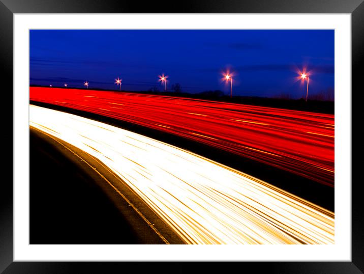 Light trails caused by multiple car headlights and tail lights Framed Mounted Print by Alan Hill