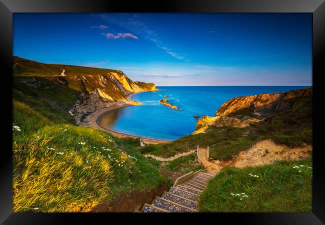 Jurassic coast and Durdle Door in Dorset at sunset Framed Print by Alan Hill