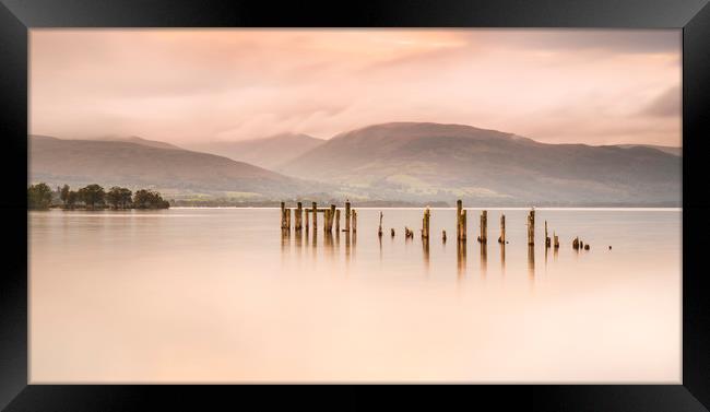 Loch Lomond jetty and mountains at sunset Framed Print by Alan Hill