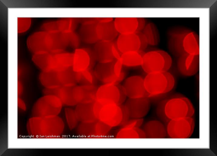 Red Circles of Bokeh on Black Framed Mounted Print by Ian Leishman