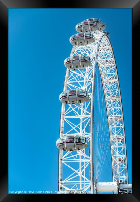 Capsules on the London Eye against a blue sky Framed Print by Dave Collins