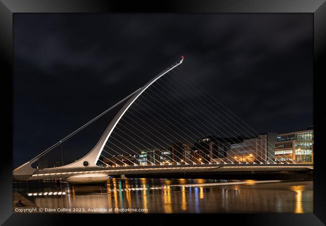 The Samuel Beckett Bridge over the River Liffey illuminated at night  (Looking upstream from the south bank), Dublin, Ireland Framed Print by Dave Collins