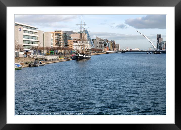 Tall Ship replica, Jeanie Johnston moored on the River Liffey and the river front buildings, Dublin, Ireland Framed Mounted Print by Dave Collins