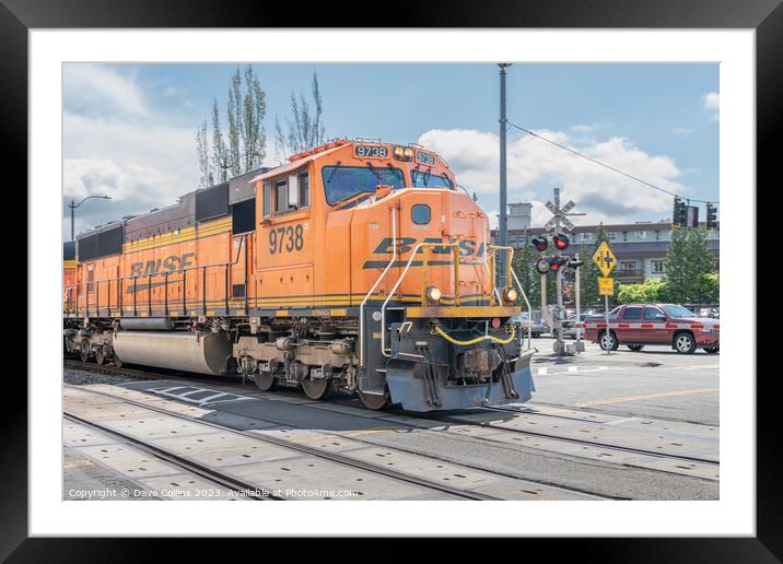 BNSF freight train passing through Seattle along Alaskan Way highway, Seattle, USA Framed Mounted Print by Dave Collins