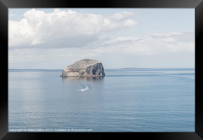 A small motor boat leaving Bass Rock, Firth of Forth, Scotland Framed Print by Dave Collins