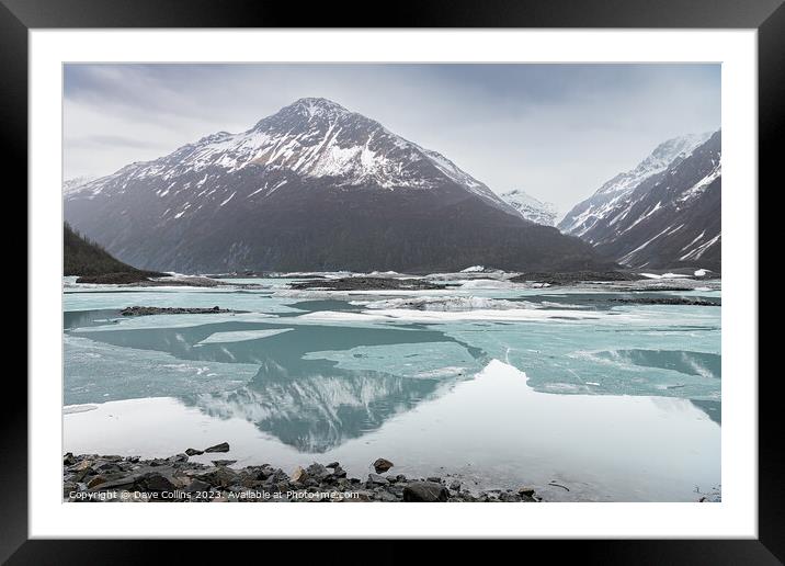 Snow covered mountains reflected between the ice sheets in Valdez Glacier Lake, Valdez, Alaska, USA Framed Mounted Print by Dave Collins